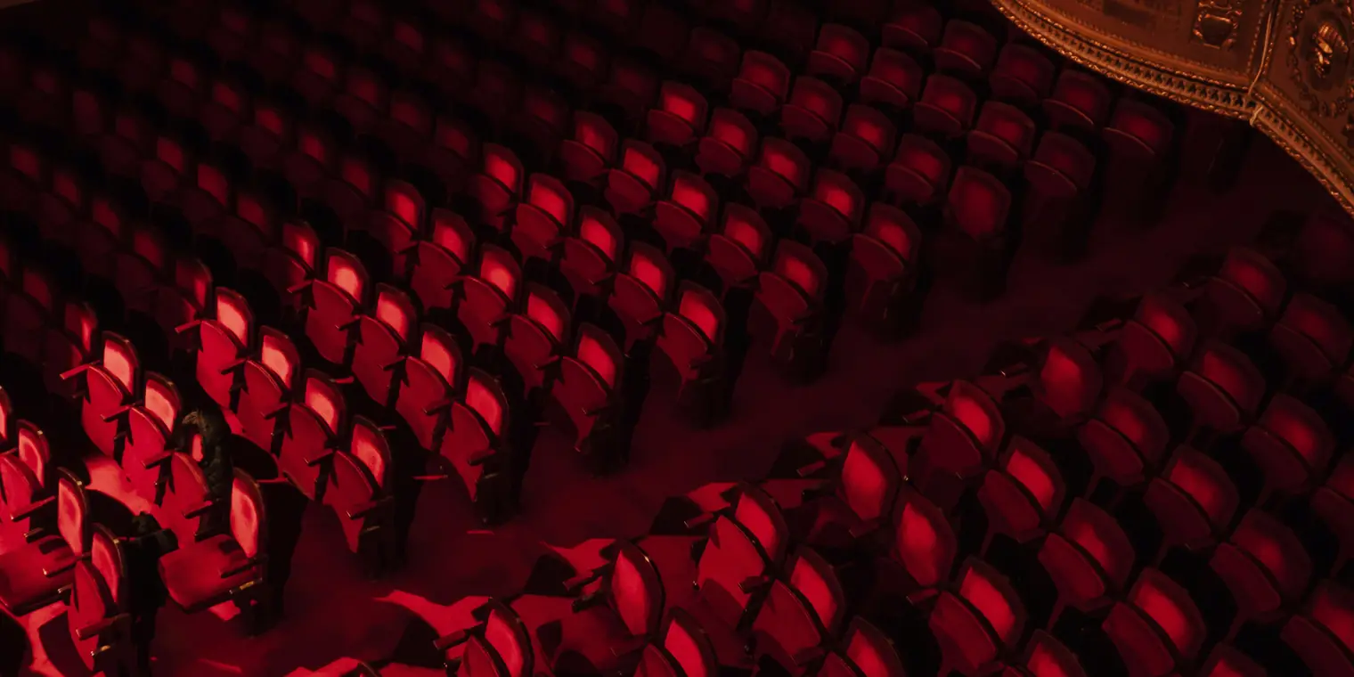 An empty theatre auditorium, prepared before the audience arrives