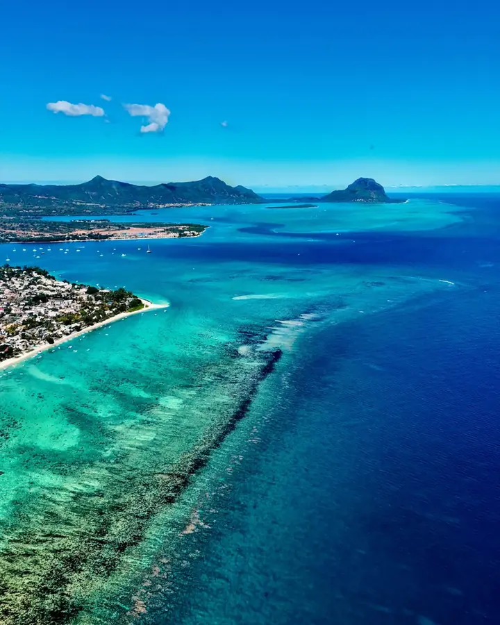A turquoise lagoon and its reef seen from the air