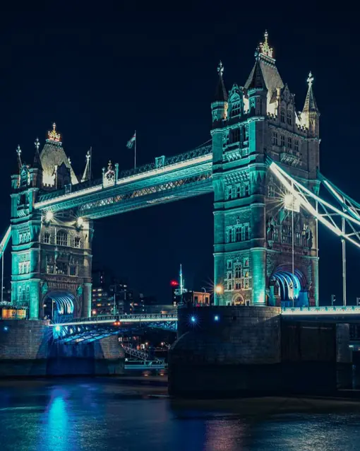 Tower Bridge lit up at night in London