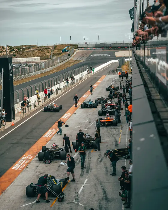 Formula 1 cars lined up in the pit lane before the start