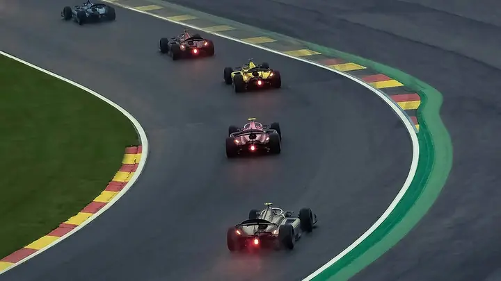 Formula 1 cars through a corner during a Grand Prix